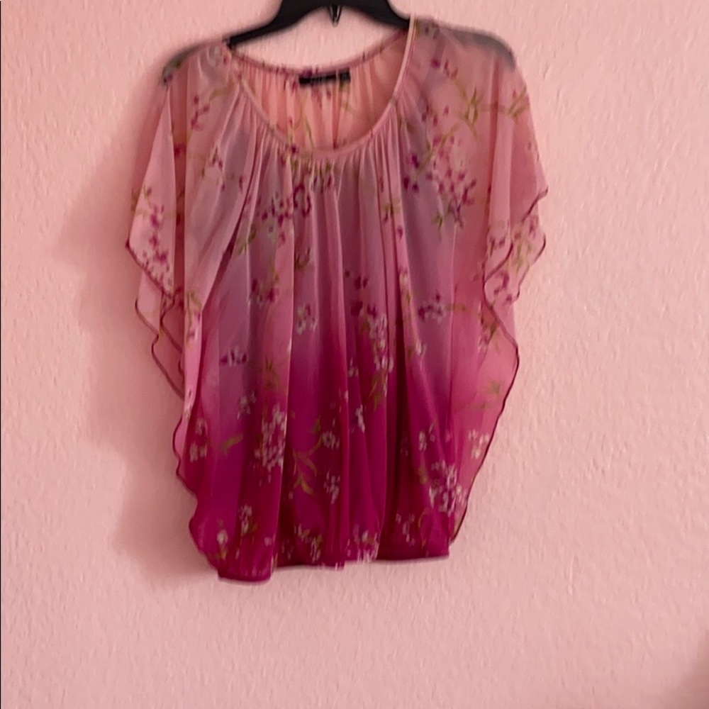 Pink floral blouse.